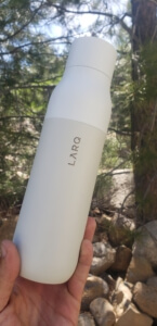 Larq Self Cleaning Water Bottle - in hand closeup