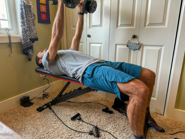 man working out on flybird fitness weight bench