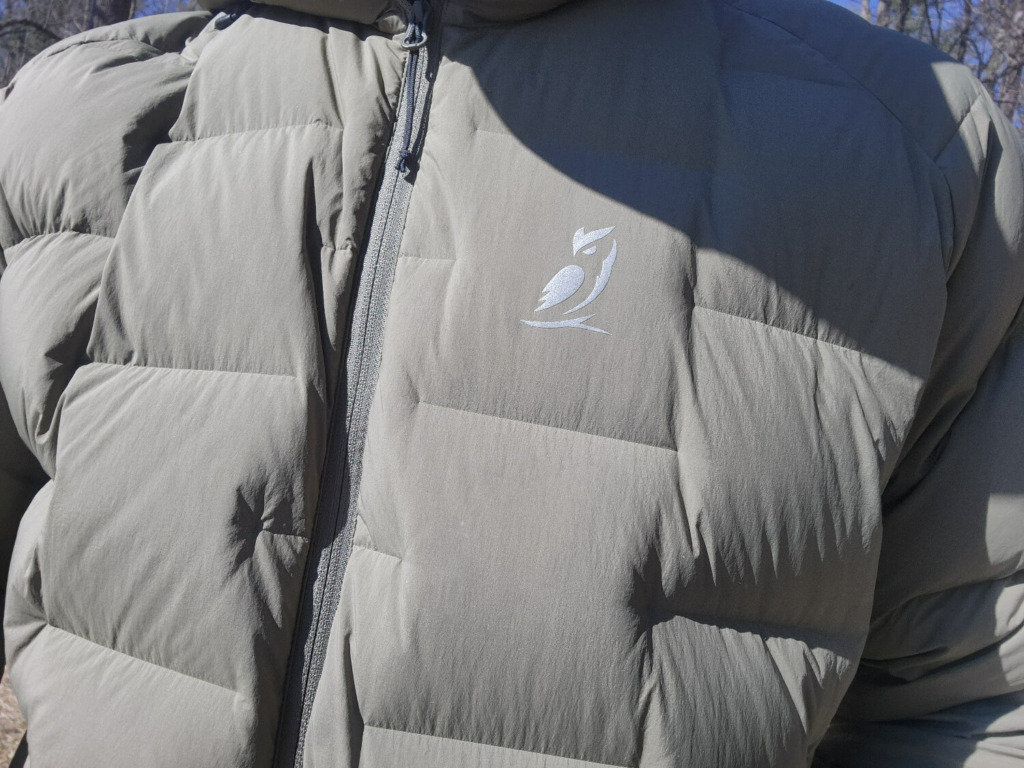Close up of Outdoor Vitals logo on Vantage Alpine Down Jacket review