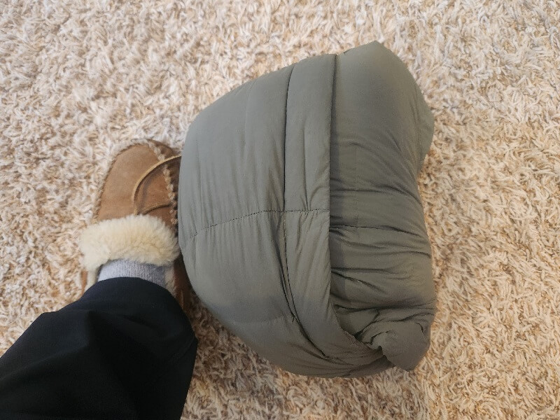 Outdoor Vitals Vantage Alpine Jacket packed into hood size compared to foot