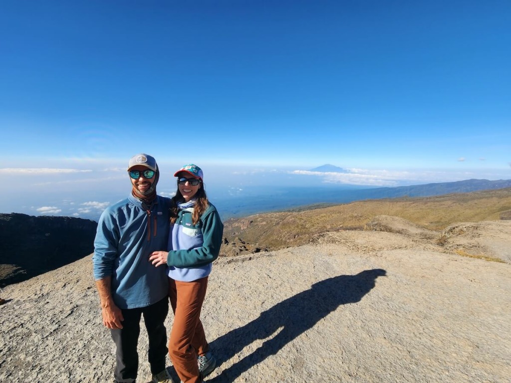 Man and woman standing at viewpoint on Kilimanjaro