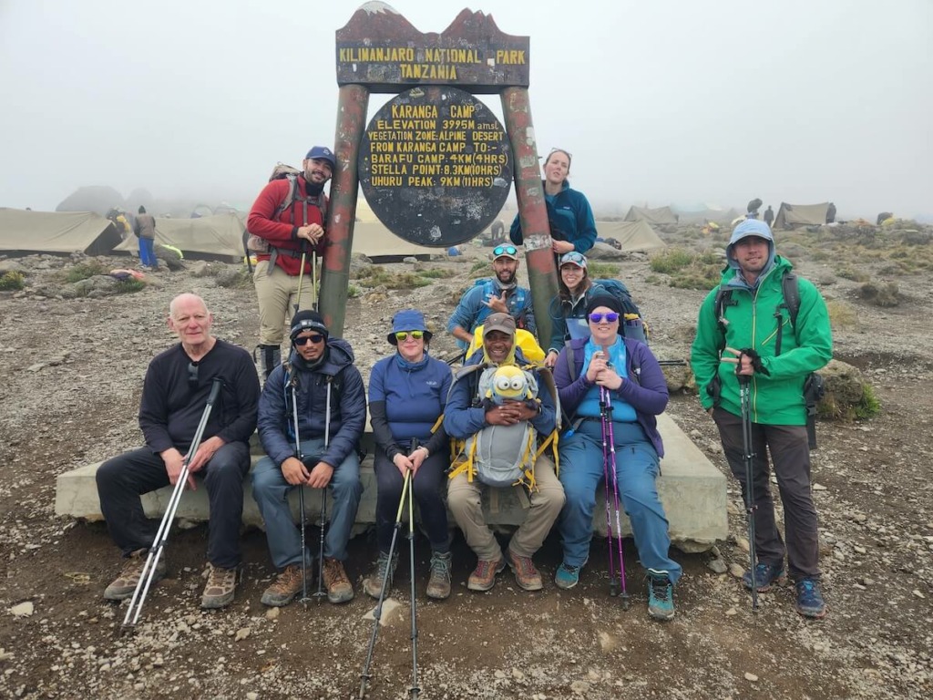 Group of hikers by sign for Karanga Camp