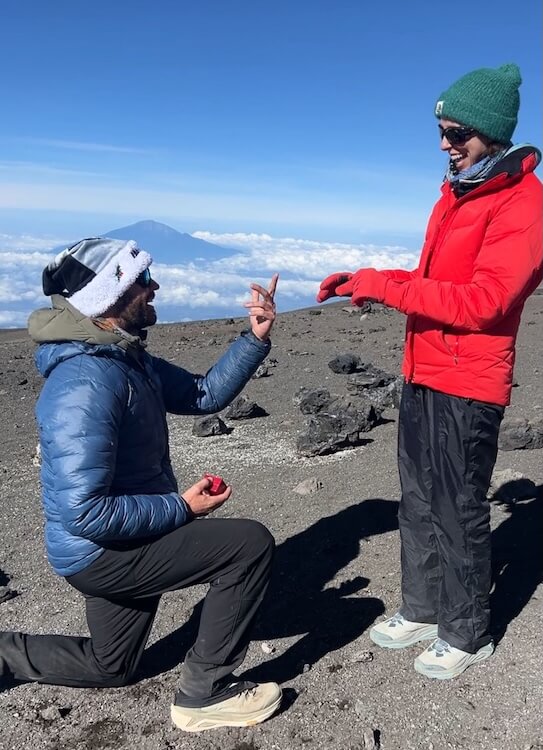 Man proposing to woman on top of Kilimanjaro