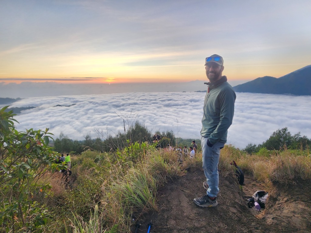 Man at sunrise on Mt Batur in Bali