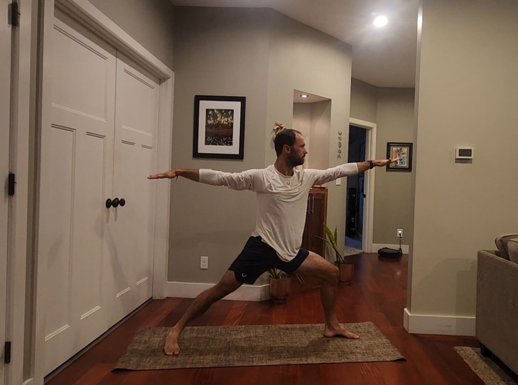 Man doing yoga wearing ASRV apparel