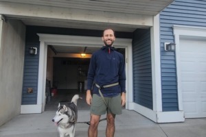 Man wearing ASRV training hoodie with dog