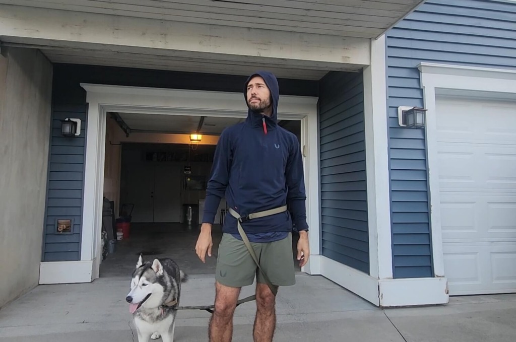 Man demonstrating hood on ASRV apparel training hoodie for review