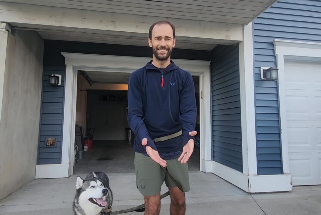 Man showing thumb holes on ASRV training hoodie